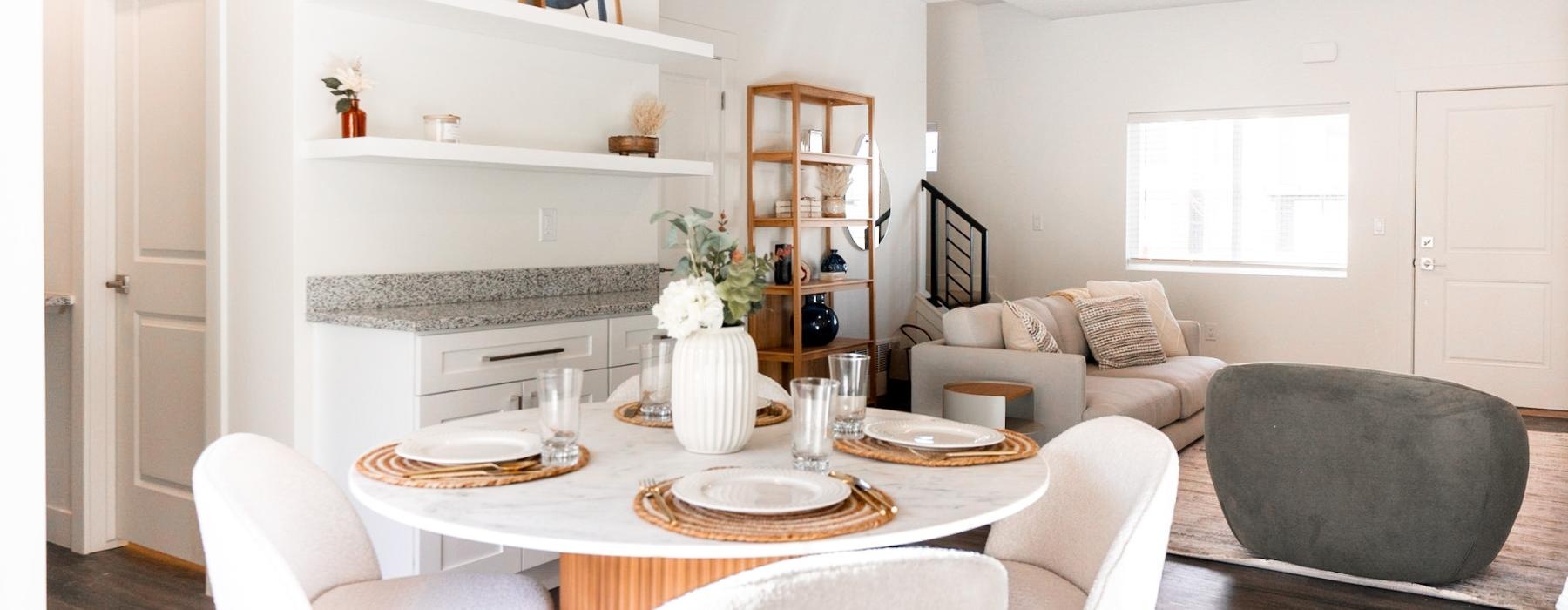 a dining room with a table and chairs