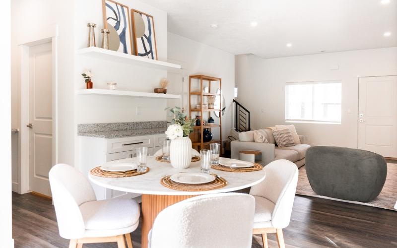 a dining room with a table and chairs